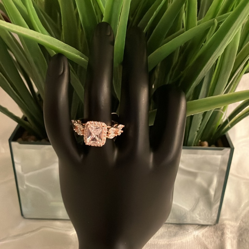 Old money Rose Gold plated CZ emerald cut center Stone Ring. CZ along the band.